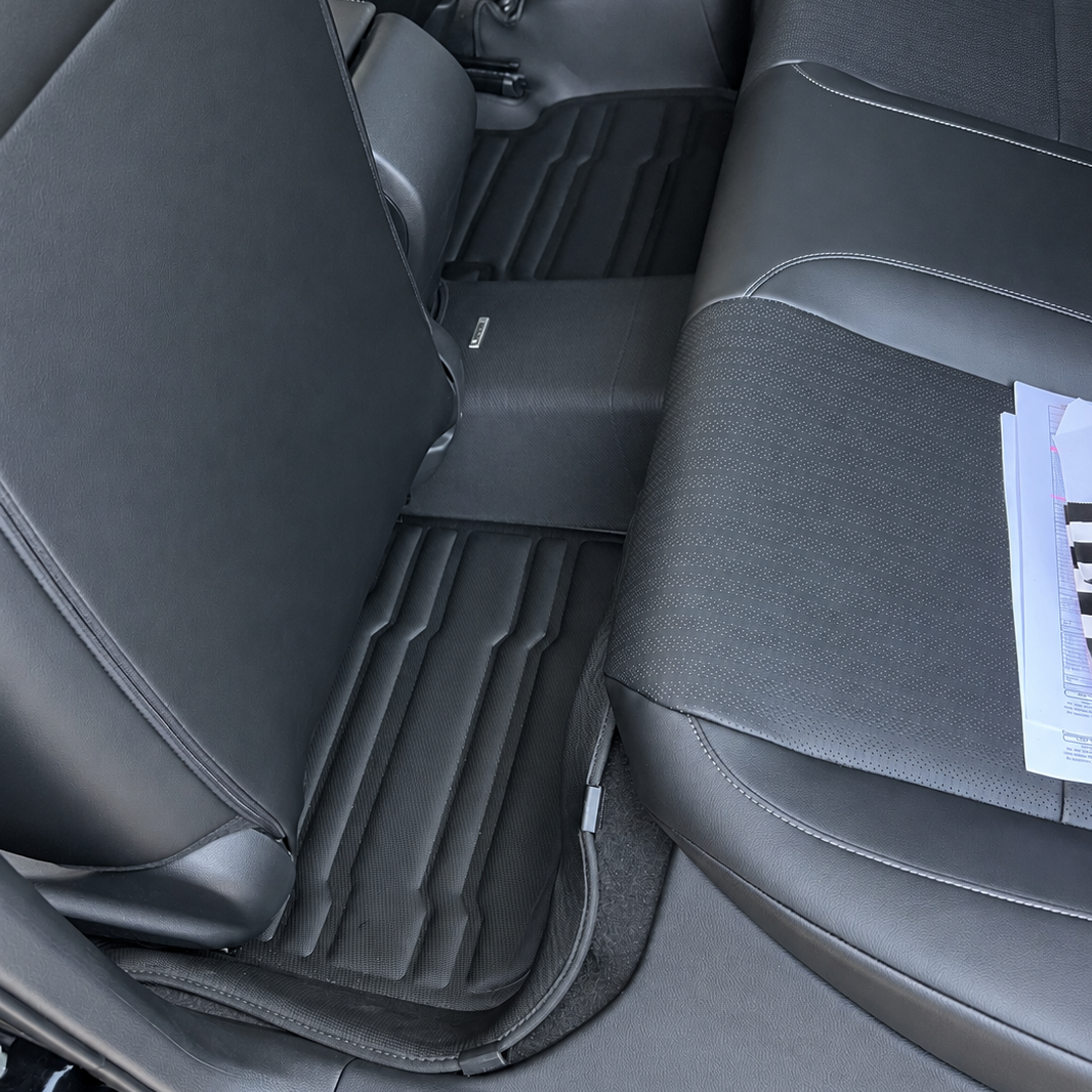 Mat Up! custom-fit all-weather floor mats installed in a vehicle footwell