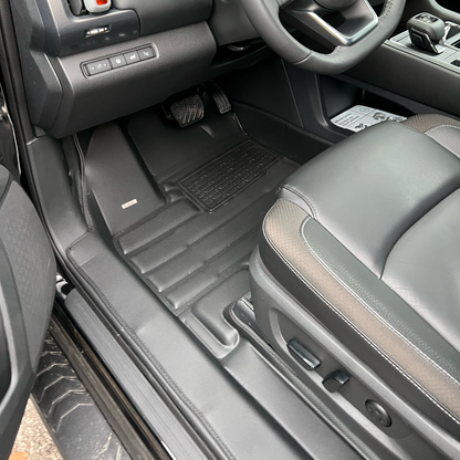 Mat Up! custom-fit all-weather floor mats installed in a vehicle footwell