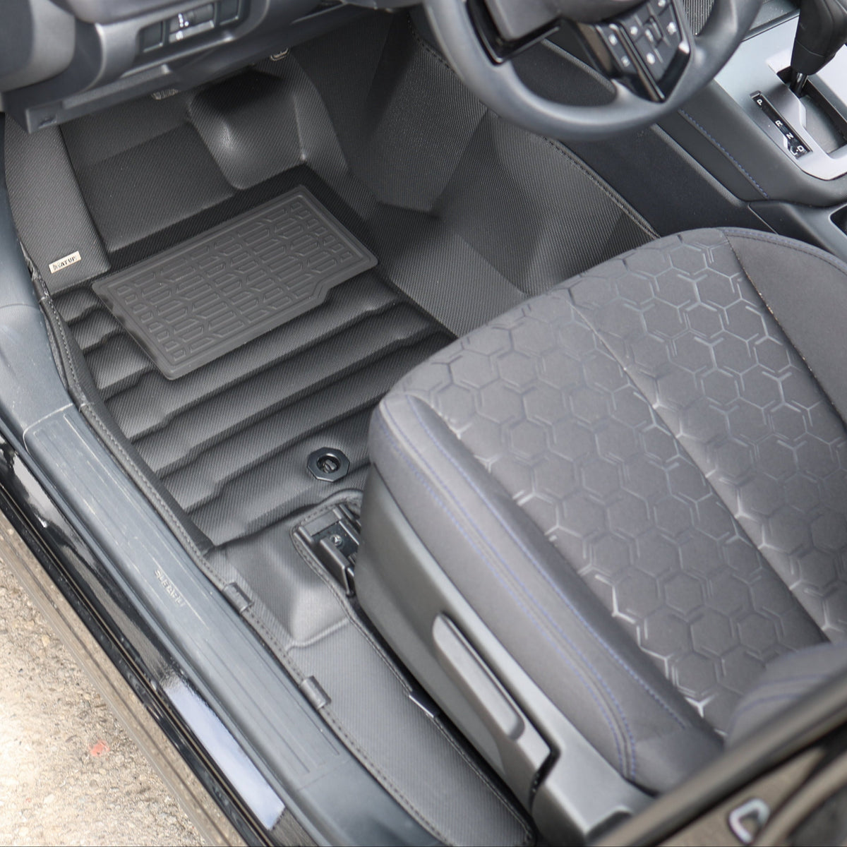 Mat Up! custom-fit all-weather floor mats installed in a vehicle footwell