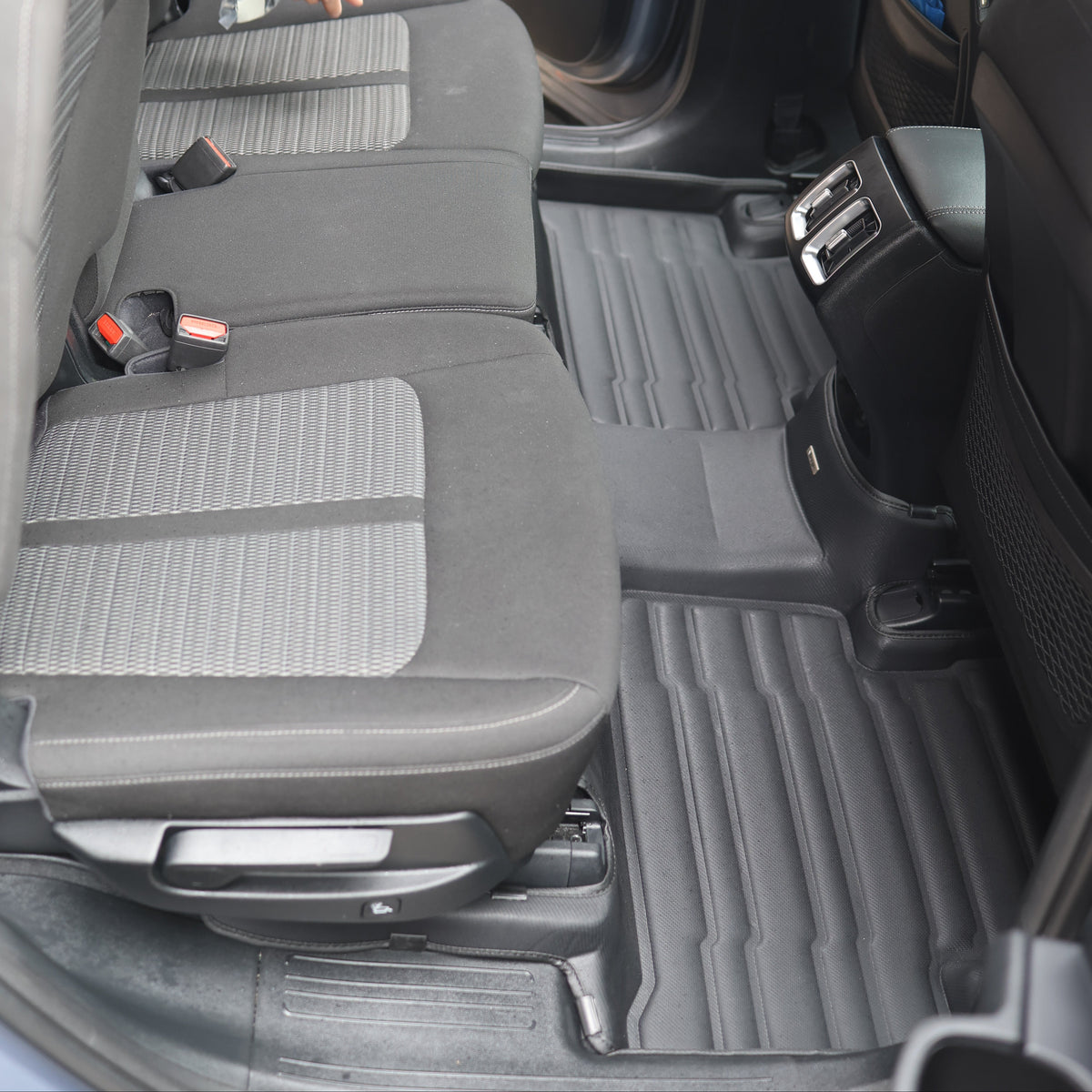 Mat Up! custom-fit all-weather floor mats installed in a vehicle footwell