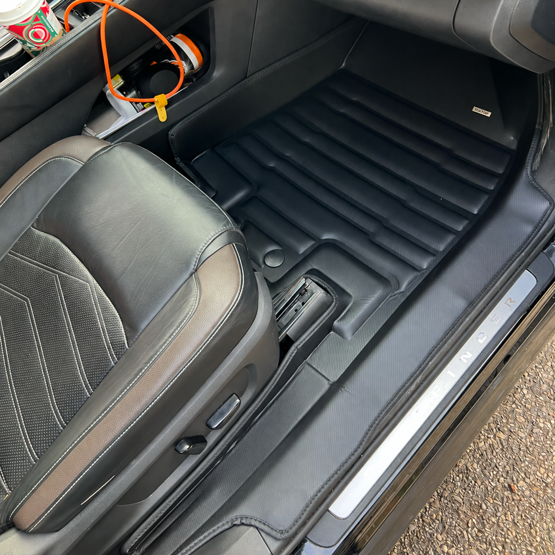 Mat Up! custom-fit all-weather floor mats installed in a vehicle footwell