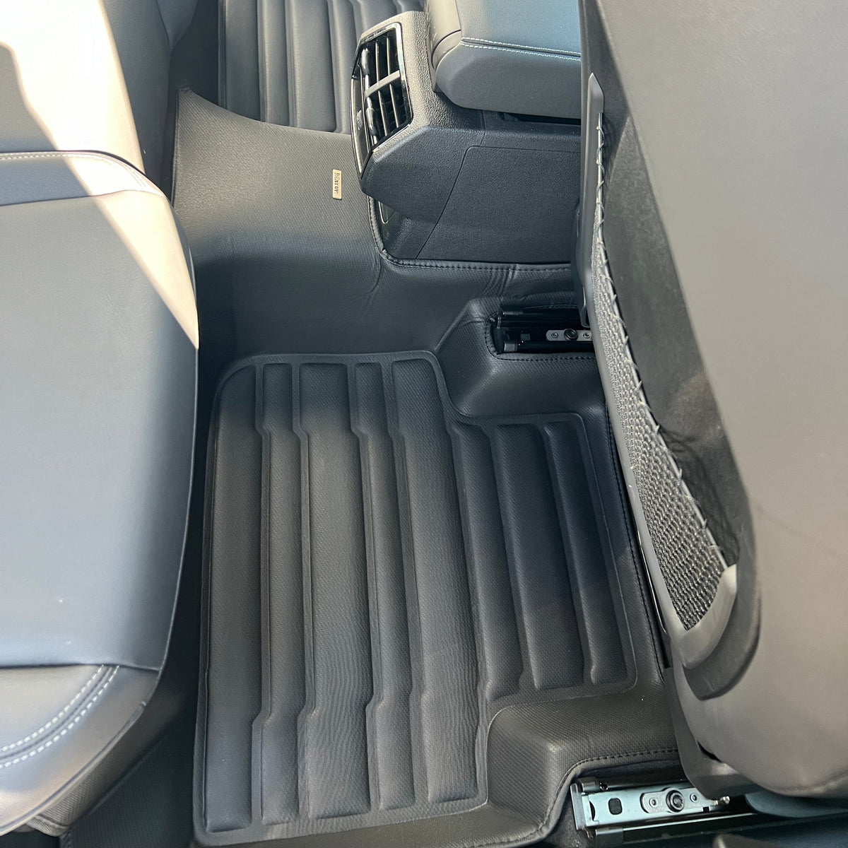 Mat Up! custom-fit all-weather floor mats installed in a vehicle footwell