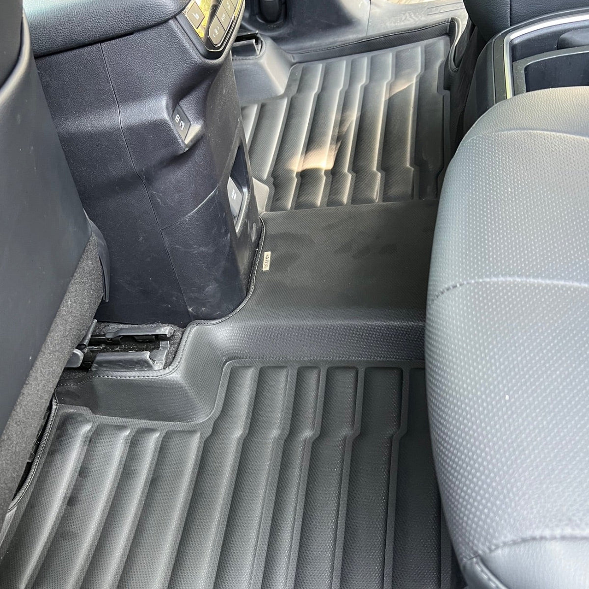 Mat Up! custom-fit all-weather floor mats installed in a vehicle footwell
