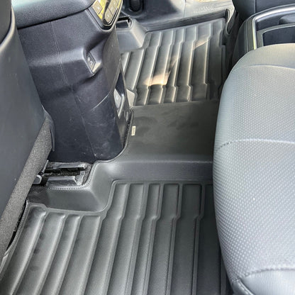 Mat Up! custom-fit all-weather floor mats installed in a vehicle footwell