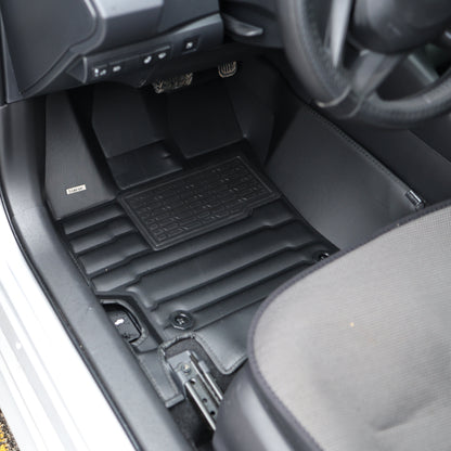 Mat Up! custom-fit all-weather floor mats installed in a vehicle footwell