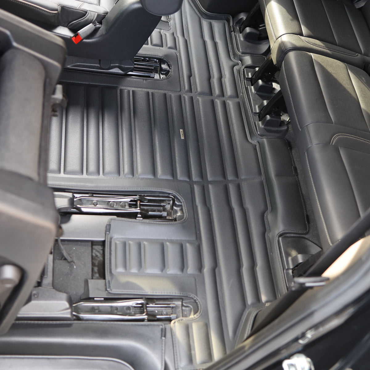 Mat Up! custom-fit all-weather floor mats installed in a vehicle footwell