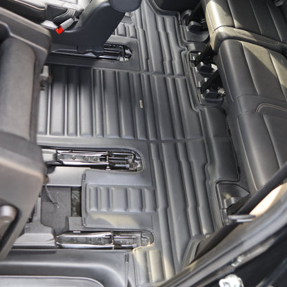 Mat Up! custom-fit all-weather floor mats installed in a vehicle footwell