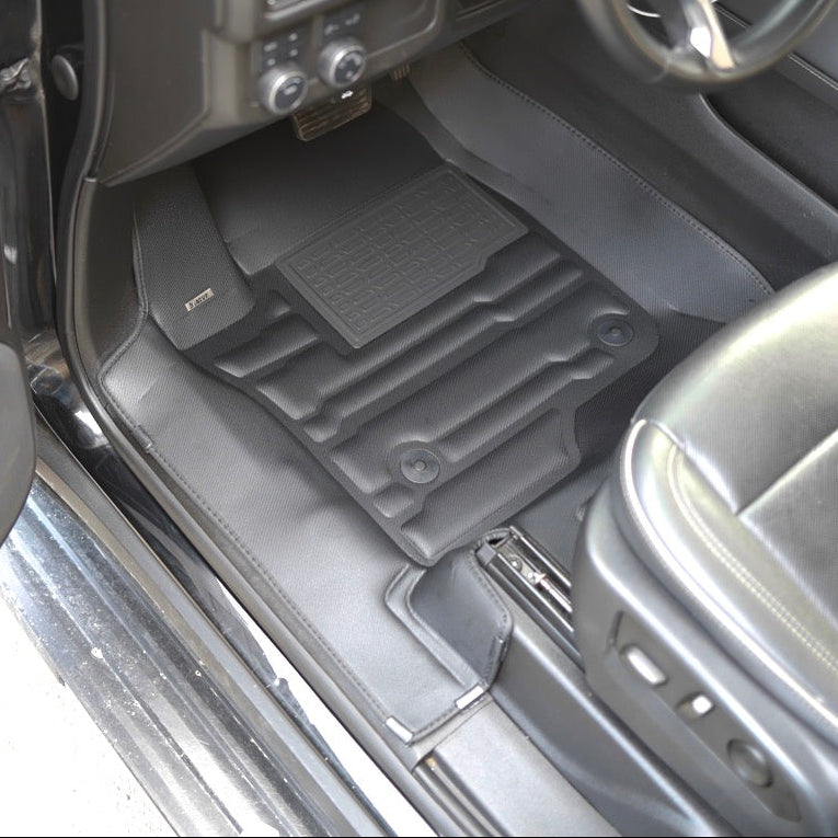 Mat Up! custom-fit all-weather floor mats installed in a vehicle footwell