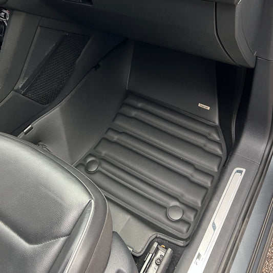 Mat Up! custom-fit all-weather floor mats installed in a vehicle footwell