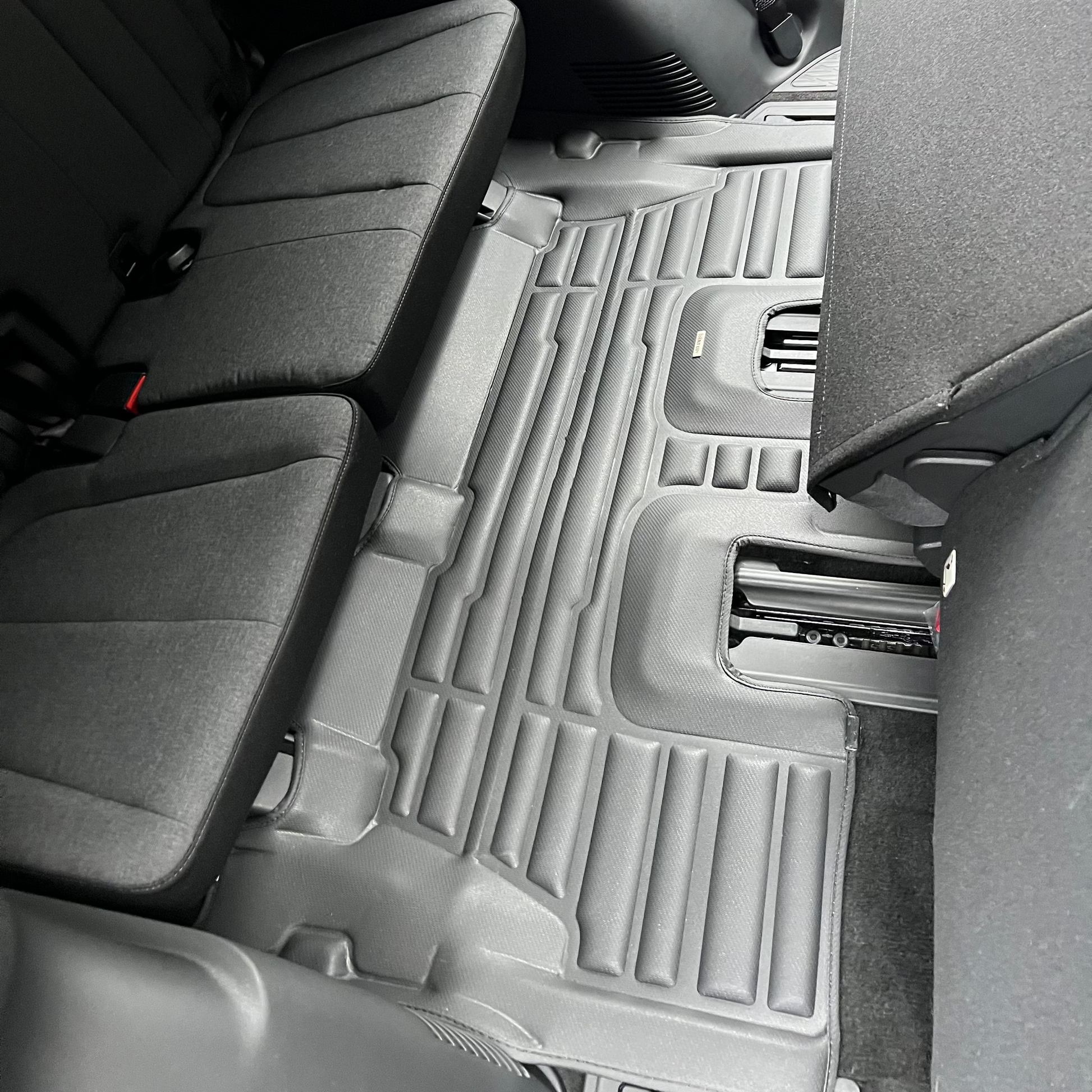 Mat Up! custom-fit all-weather floor mats installed in a vehicle footwell